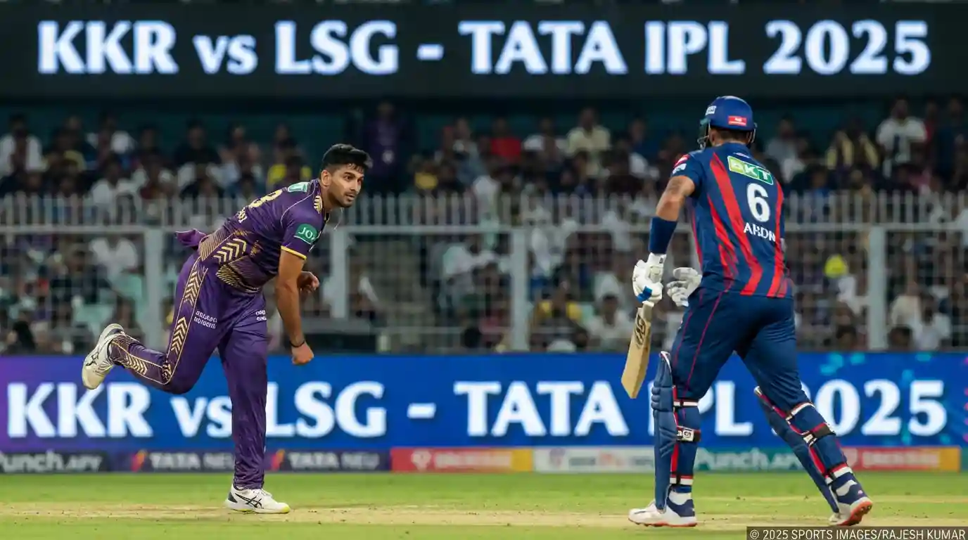 An IPL fast bowler charging in during a high-stakes night match