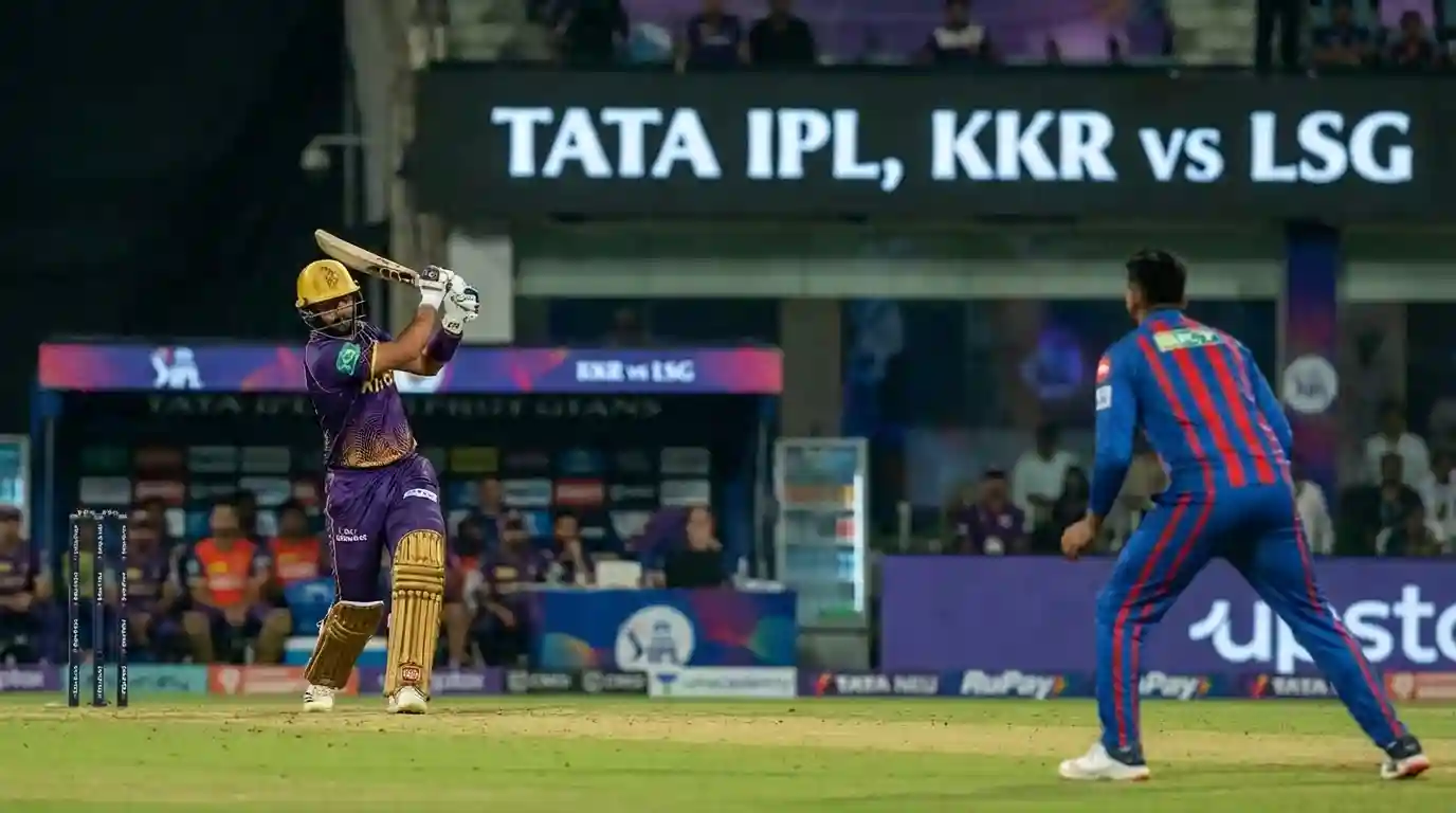 A batter smashing a powerful shot during an electric IPL night game